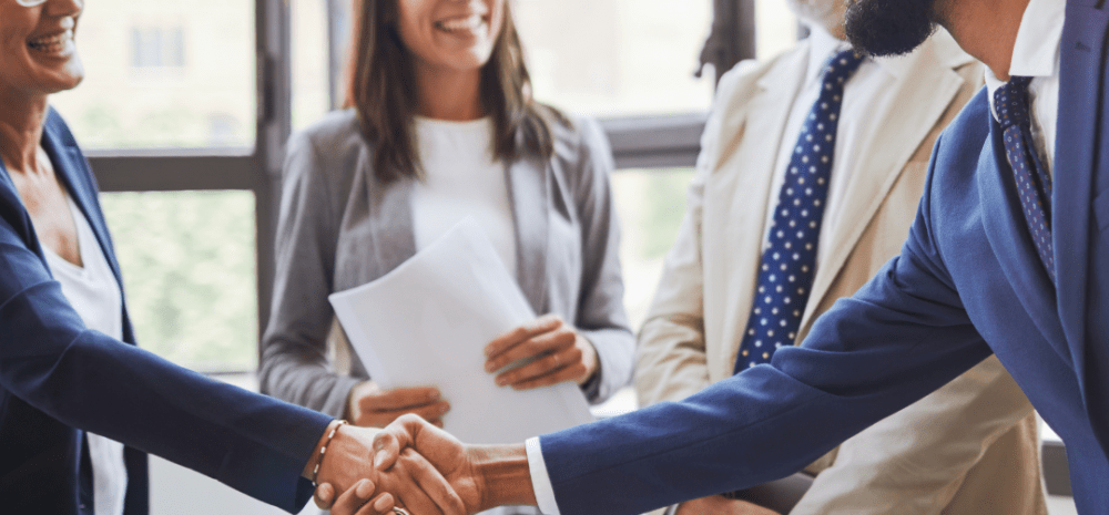 business people meeting and man shaking someone hand