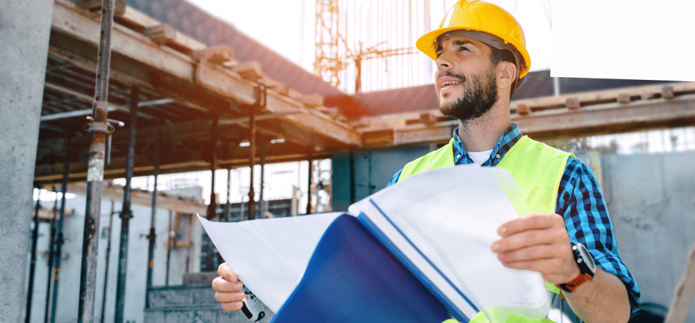 A building site worker in a hard hat.
