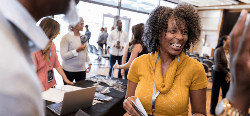Person smiling at an expo