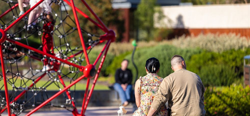 Parents sitting in a playground