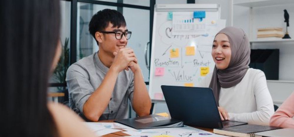 Two people sitting around a table