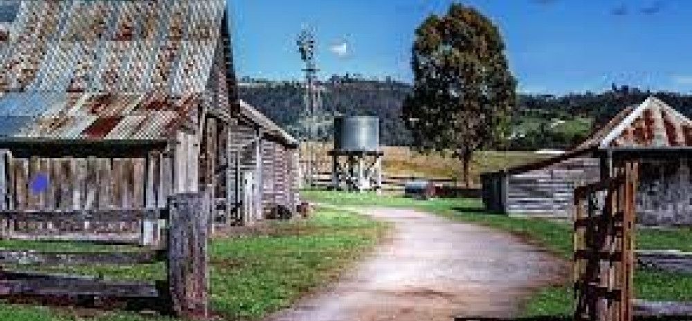 image of old buiding, water tank and windmill 