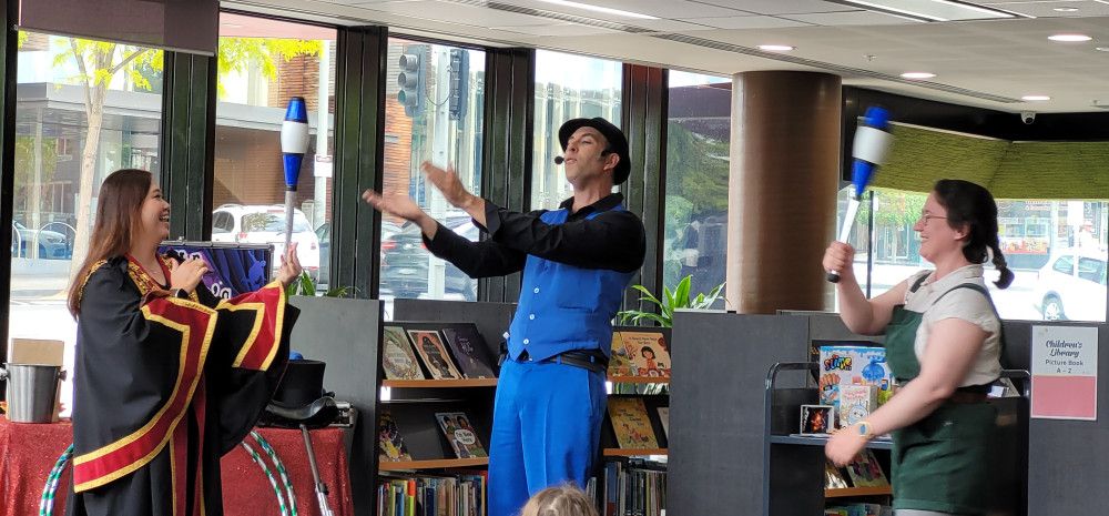 Children looking at a show in the library