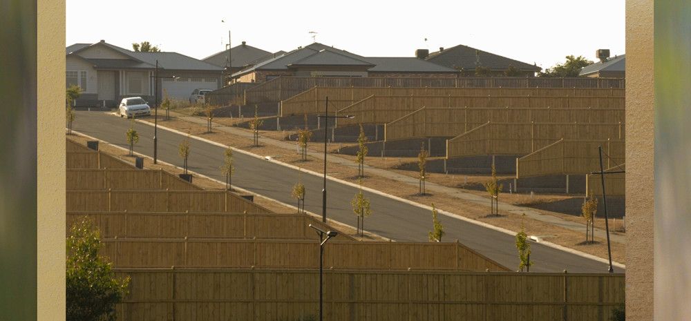 Photo from the bottom of a hill overlooking an estate.