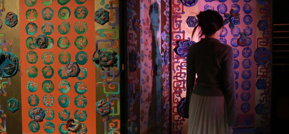 Person walking through The Maze