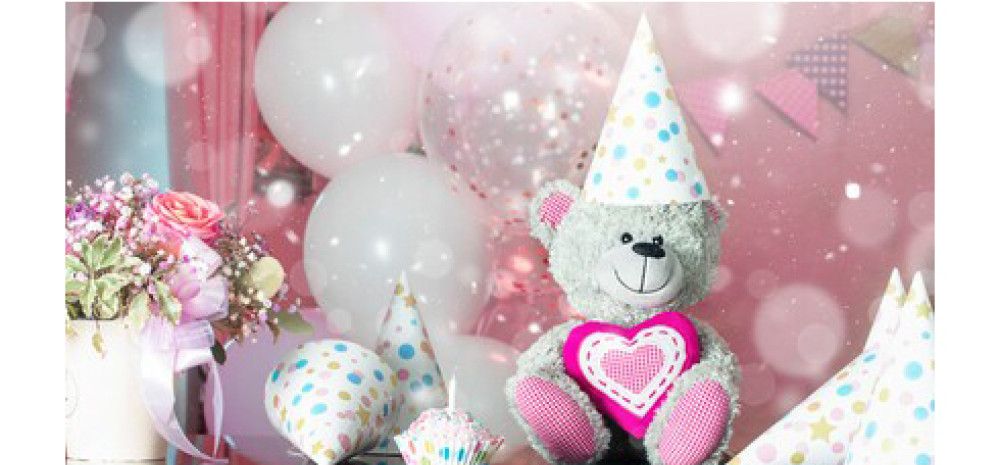 A teddy bear with party decorations
