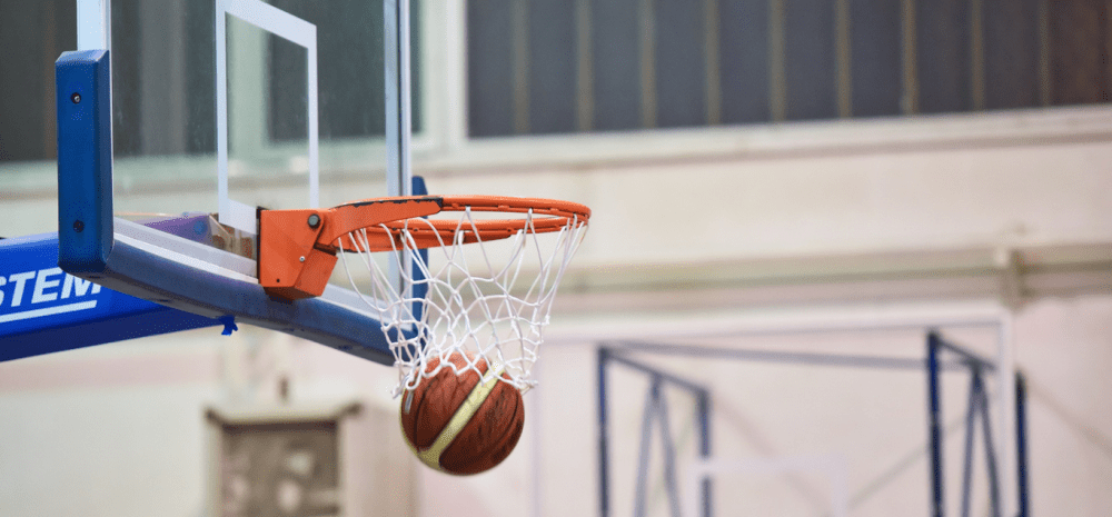 Basketball flying into a hoop