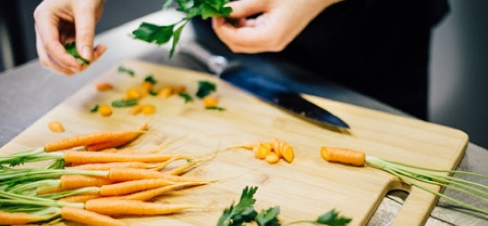 Person cutting vegetables