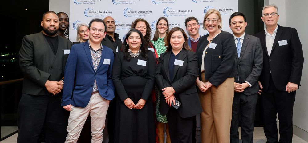 Staff smiling at a Business Awards night