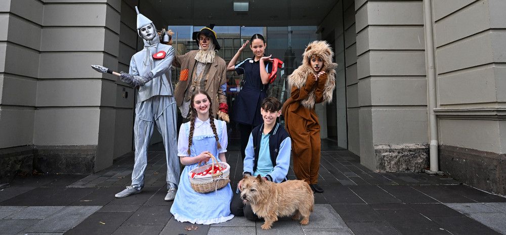 People dressed as Wizard of Oz costumes in front of the Drum Theatre