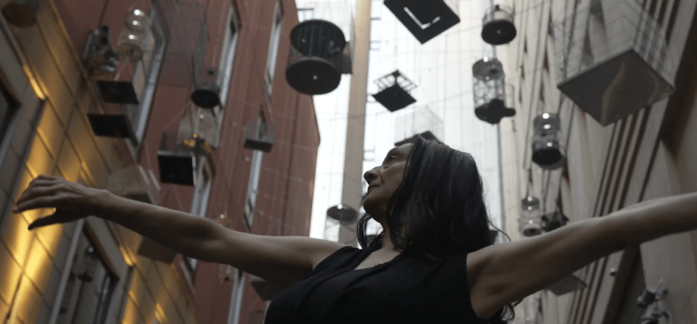 A lady with her hands in the air