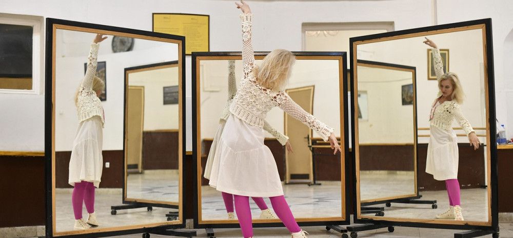 Someone dancing in front of a mirror