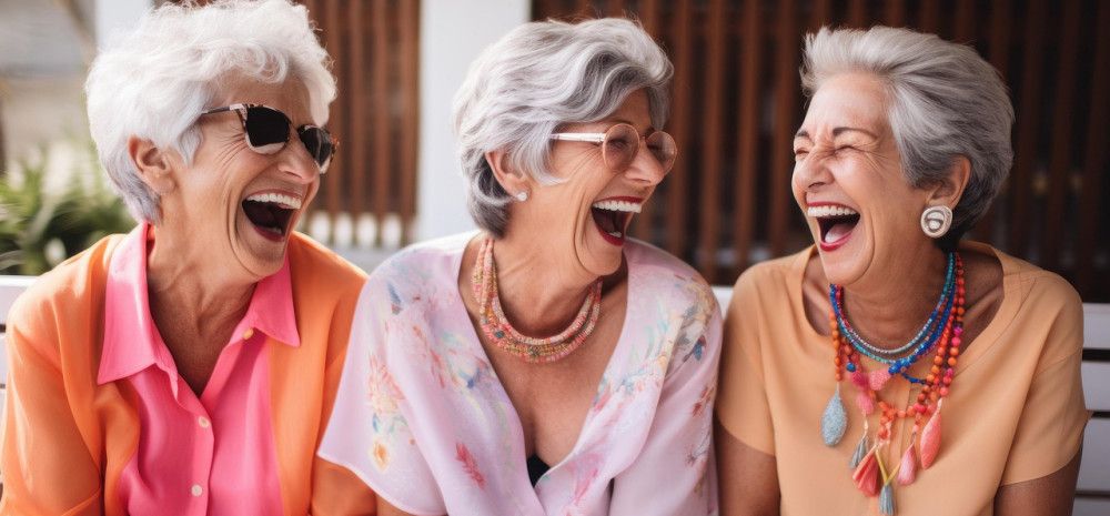 Three women laughing