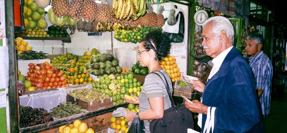 People buying food at a stall