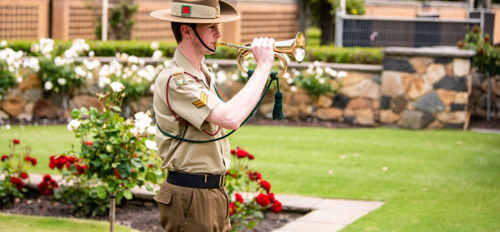 A solider playing the trumpet