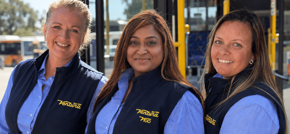 Three women smiling