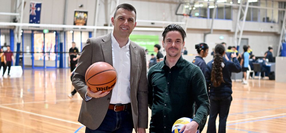 Cr Bob Milovich with another staff member at the basketball stadium