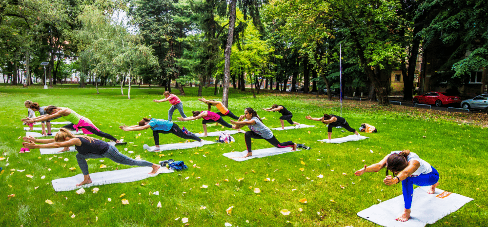 Group of women doing pilates in a park