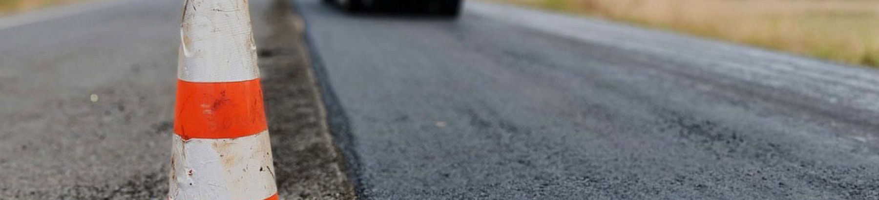 Construction of a road with a safety cone