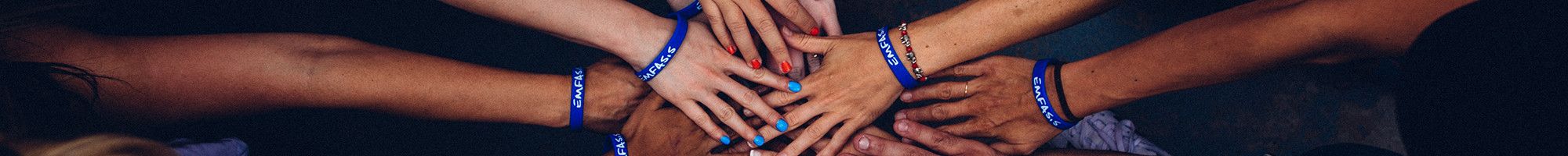 group of people put hands together