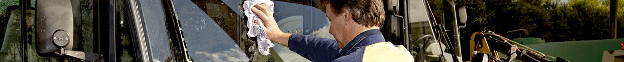 staff member cleaning equipment