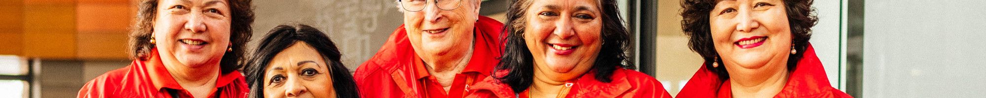 Greater Dandenong volunteers dressed in bright red jackets