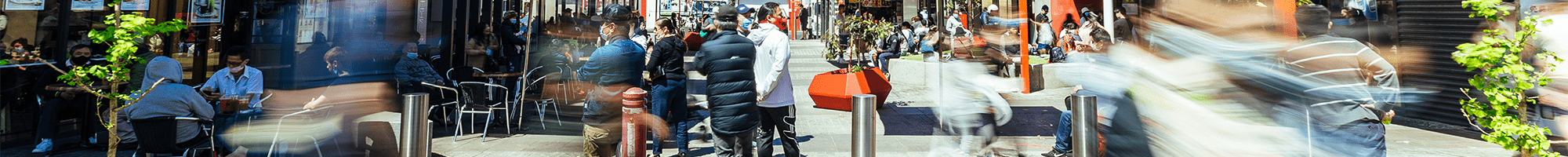 People walking in a shopping strip