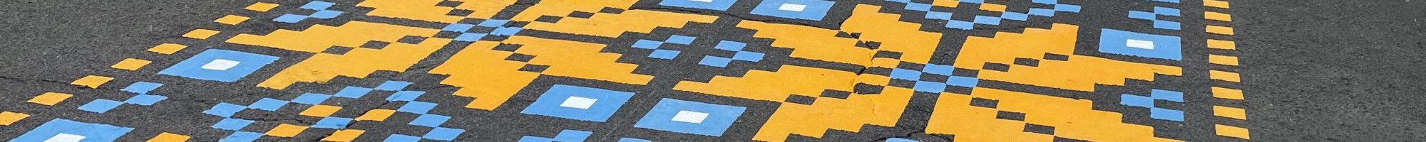 a blue and yellow mural on the road 