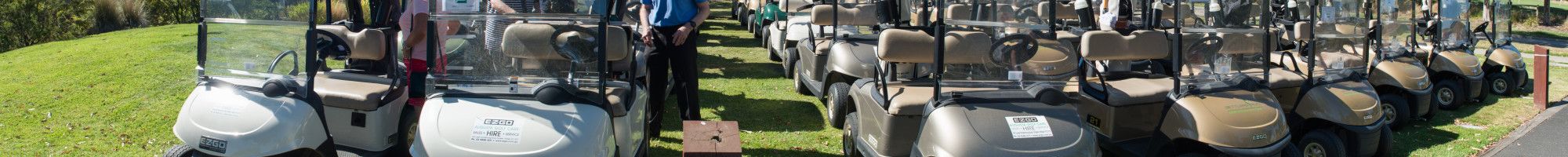 a line of golf scooters