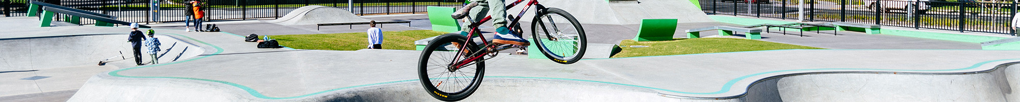 a person riding a BMX at a skate park