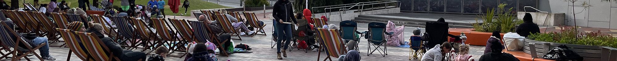 People sitting in Harmony Square