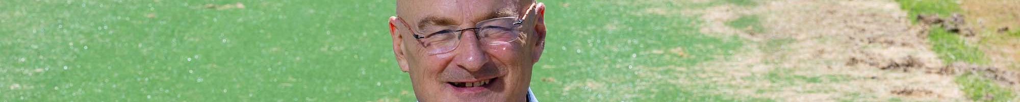 Cr Sean O'Reilly sitting on grass