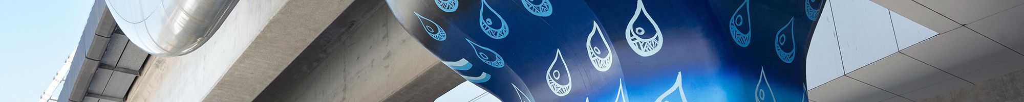 Muderra artwork on a concrete pole