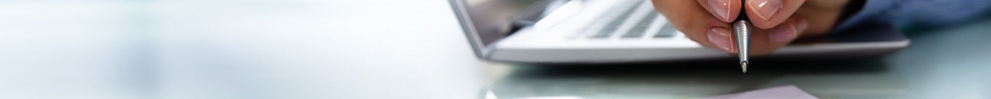Calendar and laptop on a desk