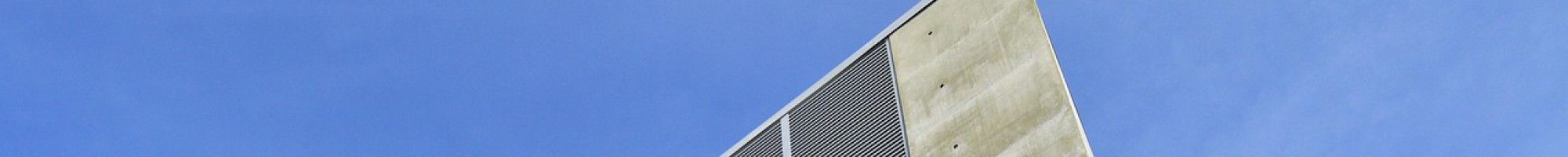 A concrete building and blue sky