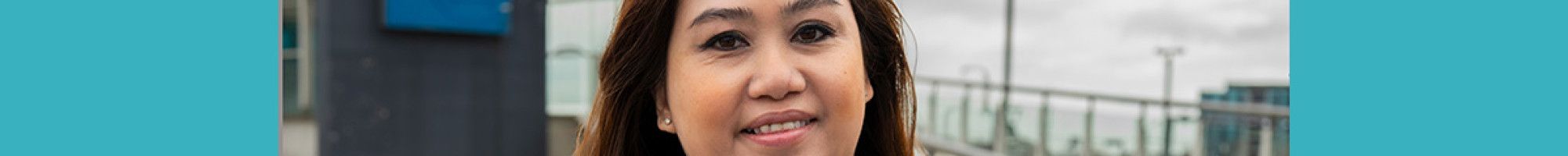 Councillor Sophie Tan holding a booklet A Great Future for Greater Dandenong