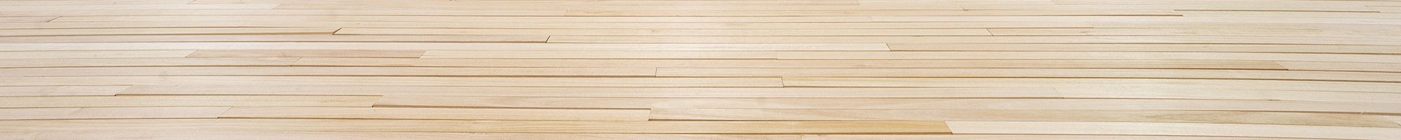 Workers complete the timber flooring at the Dandenong Stadium