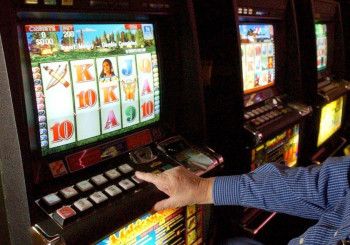 A person gambling at the pokies