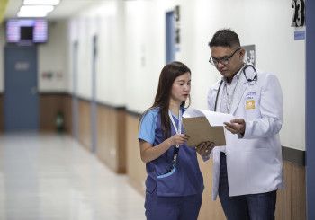 Doctor and nurse looking at paperwork