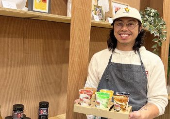 A man holding Yoghurts in plastic cups