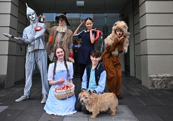 People dressed as Wizard of Oz costumes in front of the Drum Theatre