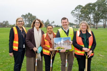 image of people in high vis with shovels