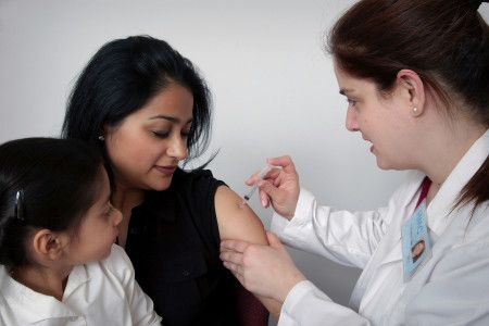 Lady receiving an immunisation injection