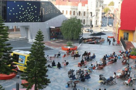 People watching the big screen in Harmony Square