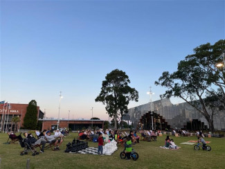 People enjoying a film at Open Air Cinema at Springvale Community Hub