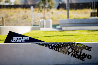 Interpretive sign at Settlers Square