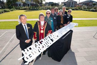 Councillors Angela Long and Richard Lim with guests at the unveiling of the Springvale Community Hospital Interpretative Sign