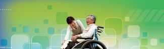 person caring for man in wheelchair one green patterned background
