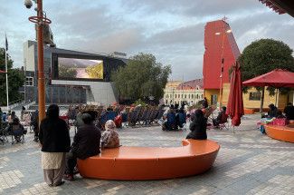 Families enjoying a movie at Harmony Square