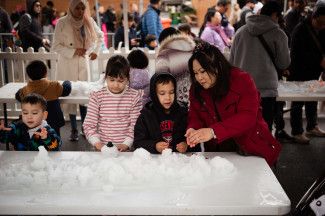 Family playing with snow